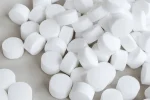 white-round-large-pills-scattered-600nw-2290331217